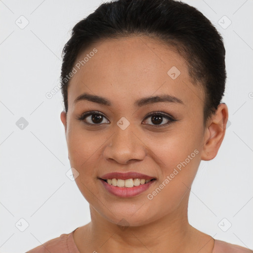 Joyful latino young-adult female with short  brown hair and brown eyes