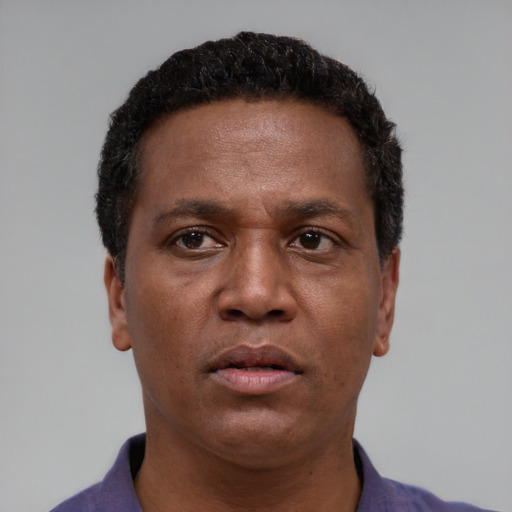 Neutral latino young-adult male with short  brown hair and brown eyes