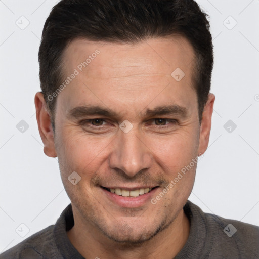 Joyful white adult male with short  brown hair and brown eyes