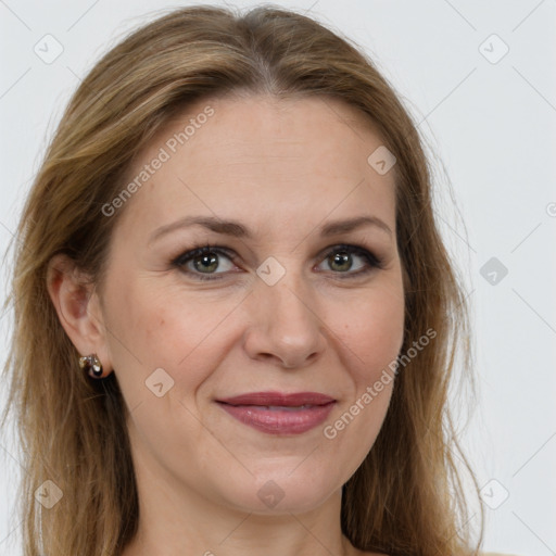 Joyful white adult female with long  brown hair and brown eyes