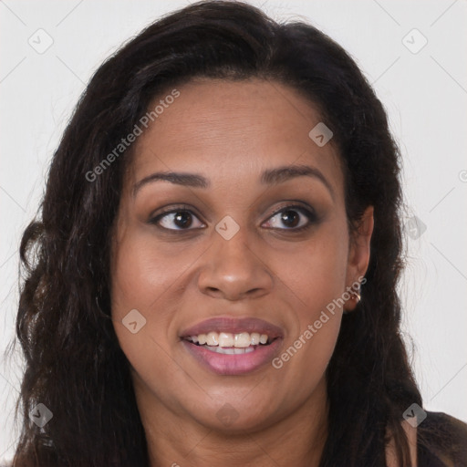 Joyful black young-adult female with long  brown hair and brown eyes