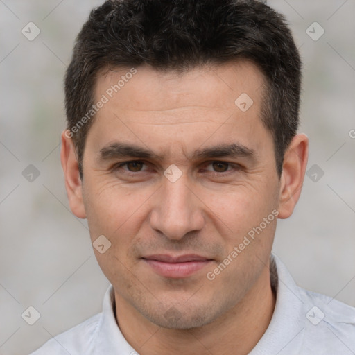 Joyful white adult male with short  brown hair and brown eyes