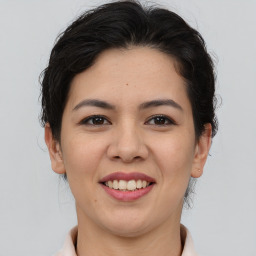 Joyful asian young-adult female with short  brown hair and brown eyes