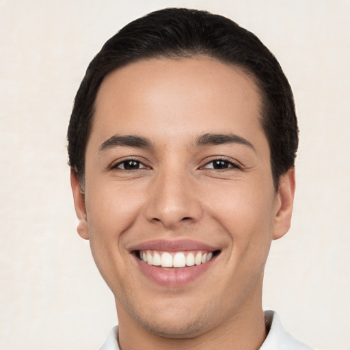 Joyful white young-adult male with short  brown hair and brown eyes