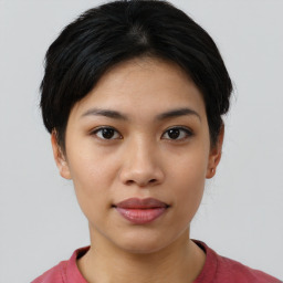 Joyful asian young-adult female with short  black hair and brown eyes