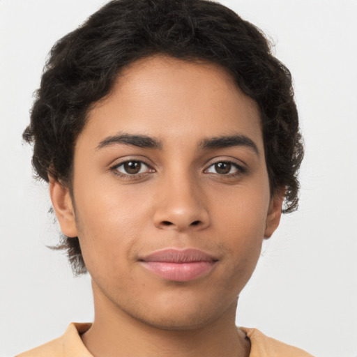 Joyful latino young-adult female with short  brown hair and brown eyes