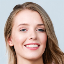 Joyful white young-adult female with long  brown hair and blue eyes