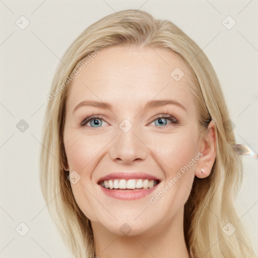 Joyful white young-adult female with long  brown hair and blue eyes