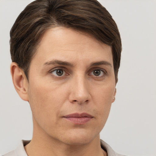 Neutral white young-adult female with short  brown hair and brown eyes