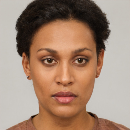 Neutral latino young-adult female with short  brown hair and brown eyes