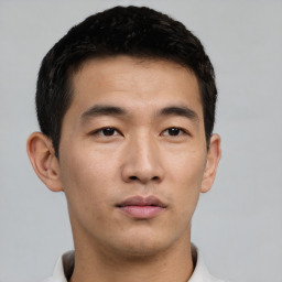 Neutral asian young-adult male with short  black hair and brown eyes