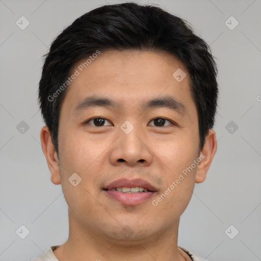 Joyful asian young-adult male with short  brown hair and brown eyes