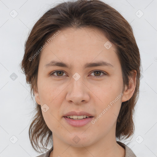 Joyful white young-adult female with medium  brown hair and brown eyes