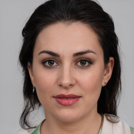 Joyful white young-adult female with medium  brown hair and brown eyes