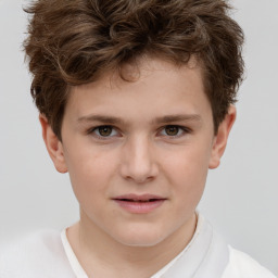 Joyful white child male with short  brown hair and brown eyes