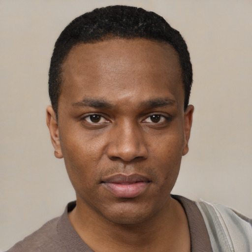 Neutral black young-adult male with short  black hair and brown eyes
