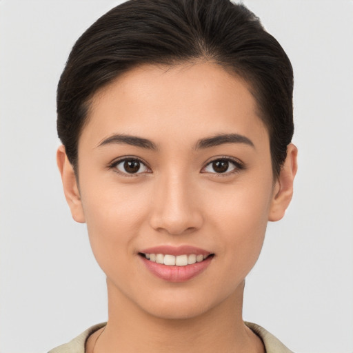 Joyful white young-adult female with short  brown hair and brown eyes