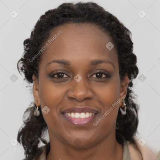 Joyful black adult female with short  brown hair and brown eyes