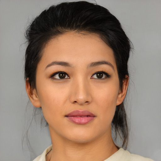 Joyful asian young-adult female with medium  brown hair and brown eyes