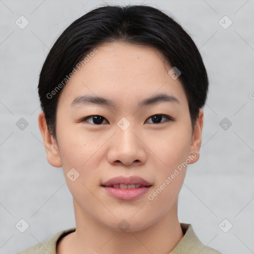 Joyful asian young-adult female with short  black hair and brown eyes