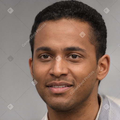 Joyful black young-adult male with short  black hair and brown eyes