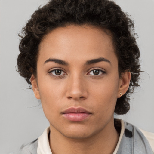 Neutral white young-adult female with short  brown hair and brown eyes