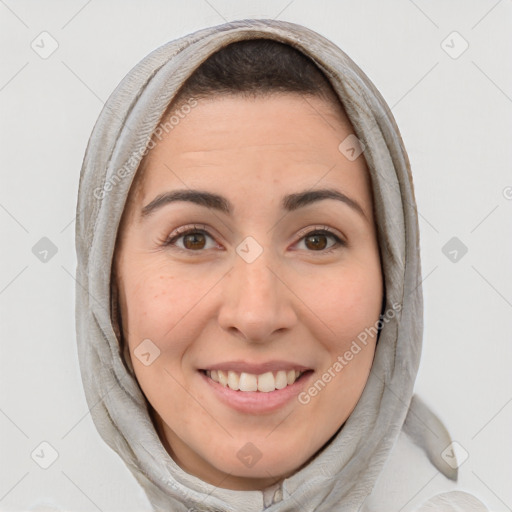 Joyful white adult female with medium  brown hair and brown eyes