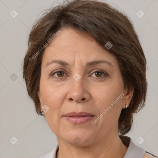 Joyful white adult female with medium  brown hair and brown eyes