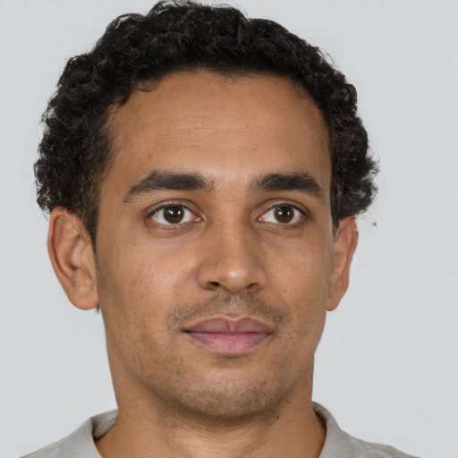 Neutral latino young-adult male with short  brown hair and brown eyes