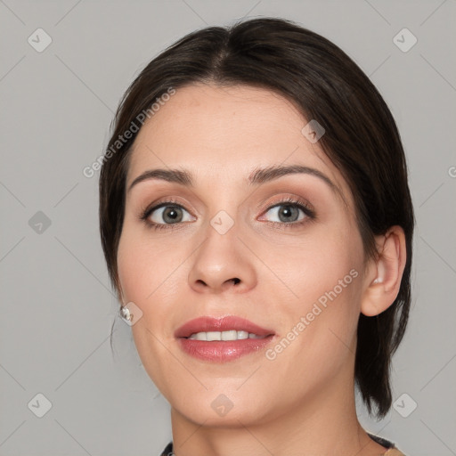 Joyful white young-adult female with medium  brown hair and brown eyes