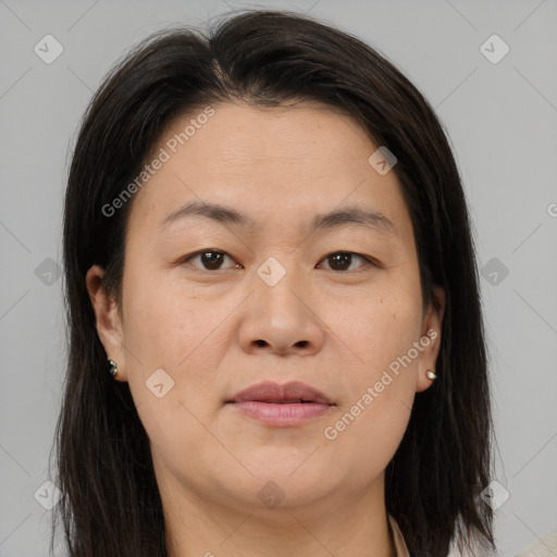 Joyful asian adult female with medium  brown hair and brown eyes