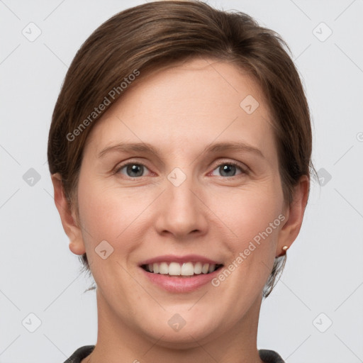 Joyful white young-adult female with short  brown hair and grey eyes