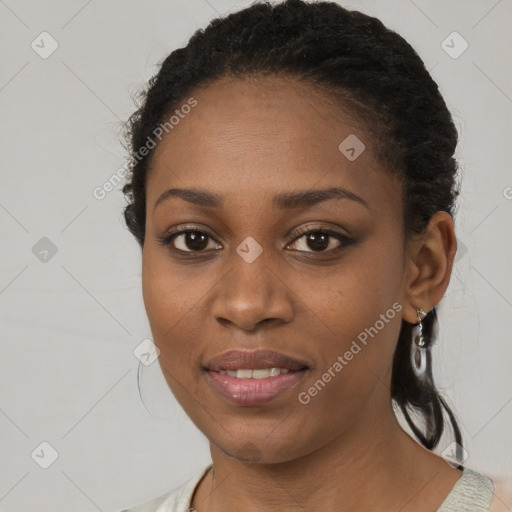 Joyful black young-adult female with medium  black hair and brown eyes