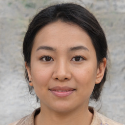 Joyful asian young-adult female with medium  brown hair and brown eyes