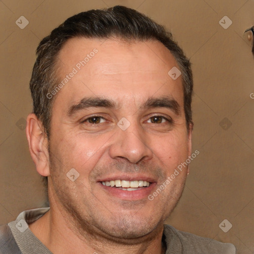 Joyful white adult male with short  brown hair and brown eyes