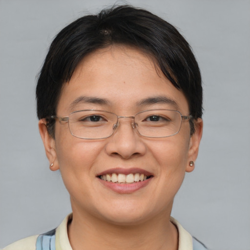 Joyful white adult female with short  brown hair and brown eyes