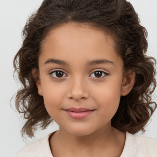 Joyful white child female with medium  brown hair and brown eyes