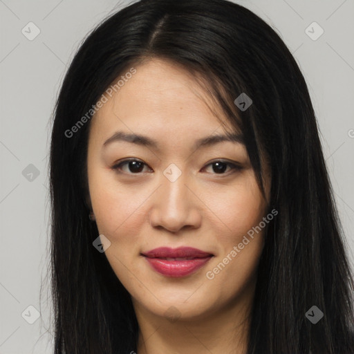 Joyful asian young-adult female with long  brown hair and brown eyes