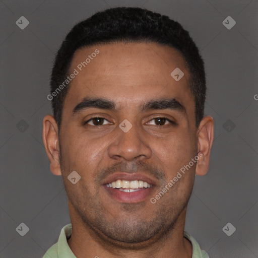 Joyful black young-adult male with short  brown hair and brown eyes