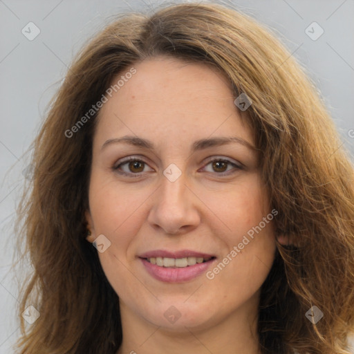 Joyful white adult female with long  brown hair and brown eyes