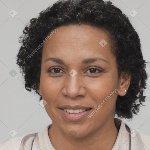 Joyful latino adult female with short  brown hair and brown eyes