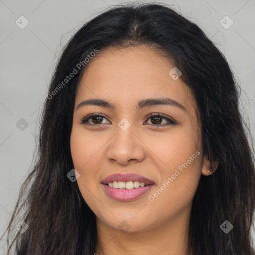 Joyful latino young-adult female with long  brown hair and brown eyes