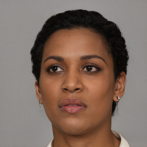 Neutral black young-adult female with short  black hair and brown eyes