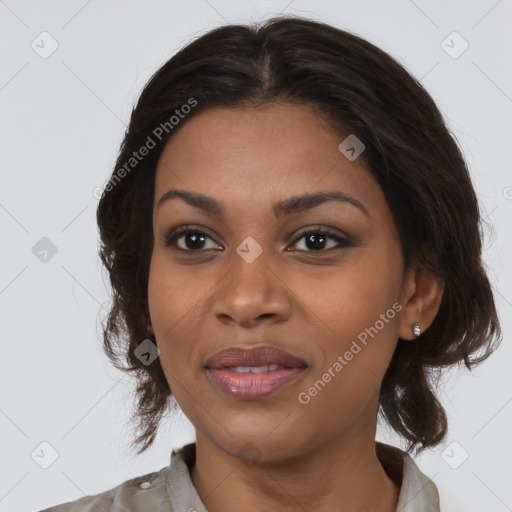 Joyful black young-adult female with medium  brown hair and brown eyes