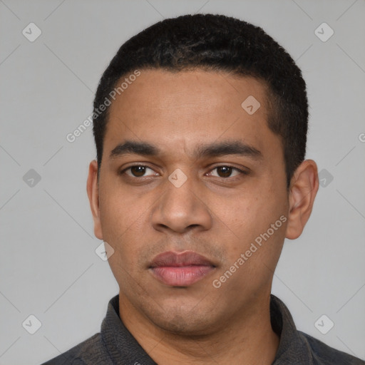Neutral latino young-adult male with short  black hair and brown eyes