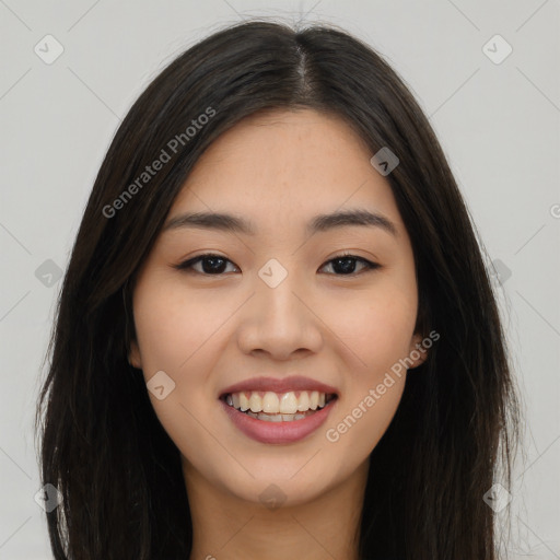 Joyful asian young-adult female with long  brown hair and brown eyes