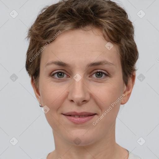 Joyful white young-adult female with short  brown hair and grey eyes