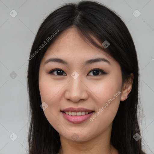 Joyful asian young-adult female with long  brown hair and brown eyes