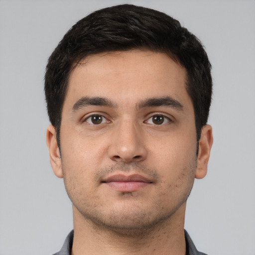 Neutral white young-adult male with short  black hair and brown eyes