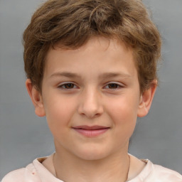 Joyful white child male with short  brown hair and brown eyes